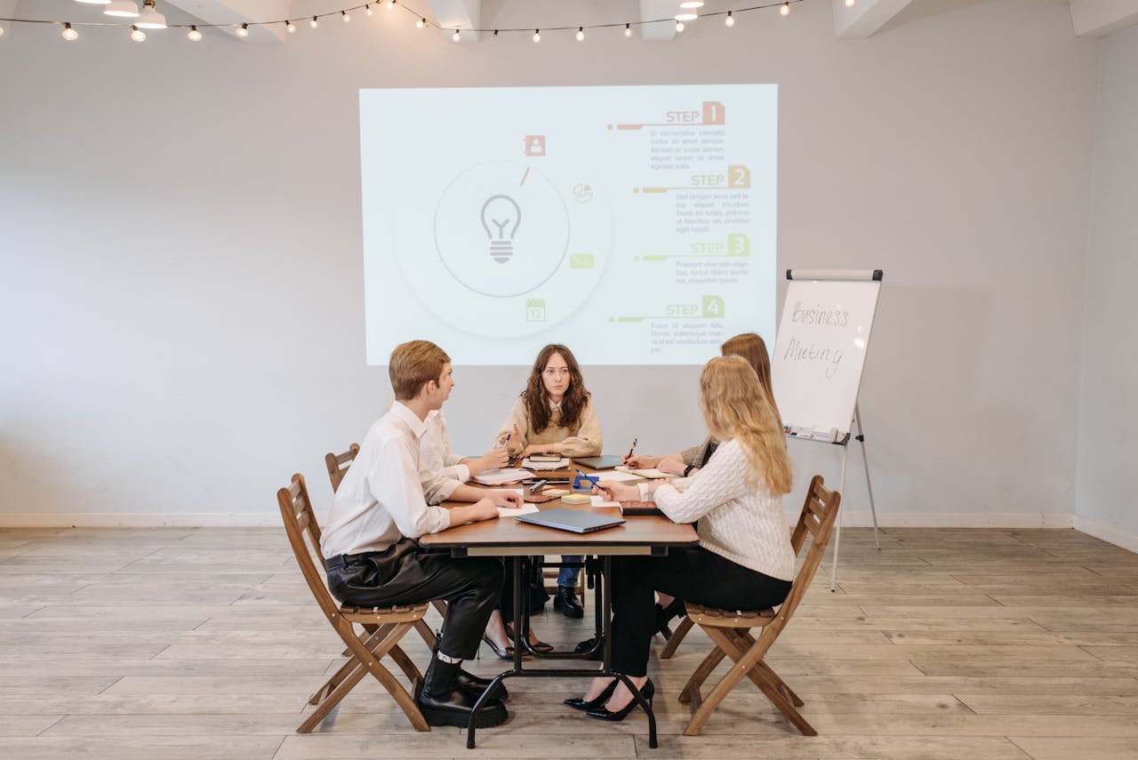Business team discussing new strategies in a collaborative meeting environment.